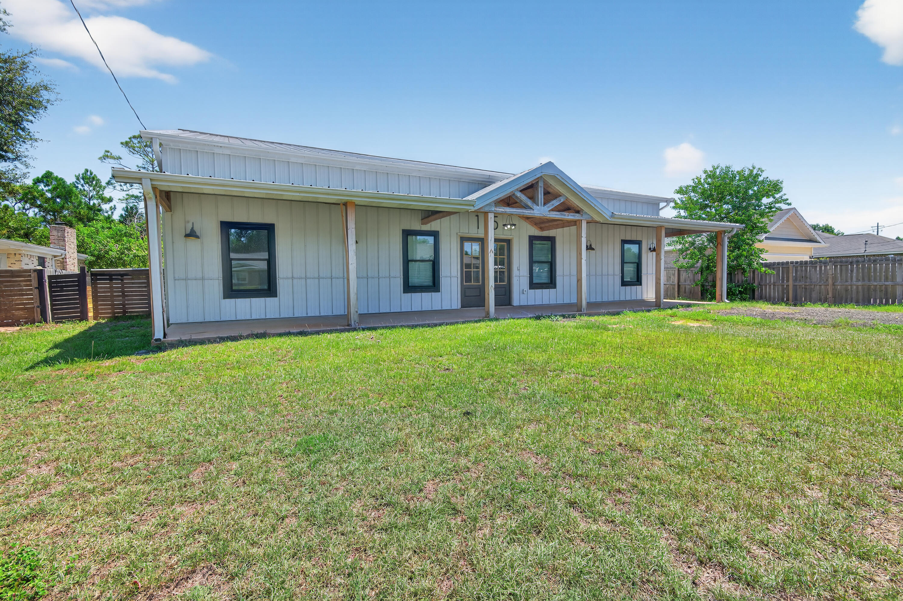 115 Ridgewood Avenue Mary Esther, FL 32569 - Photo 2 of 54 a view of a house with a yard and porch