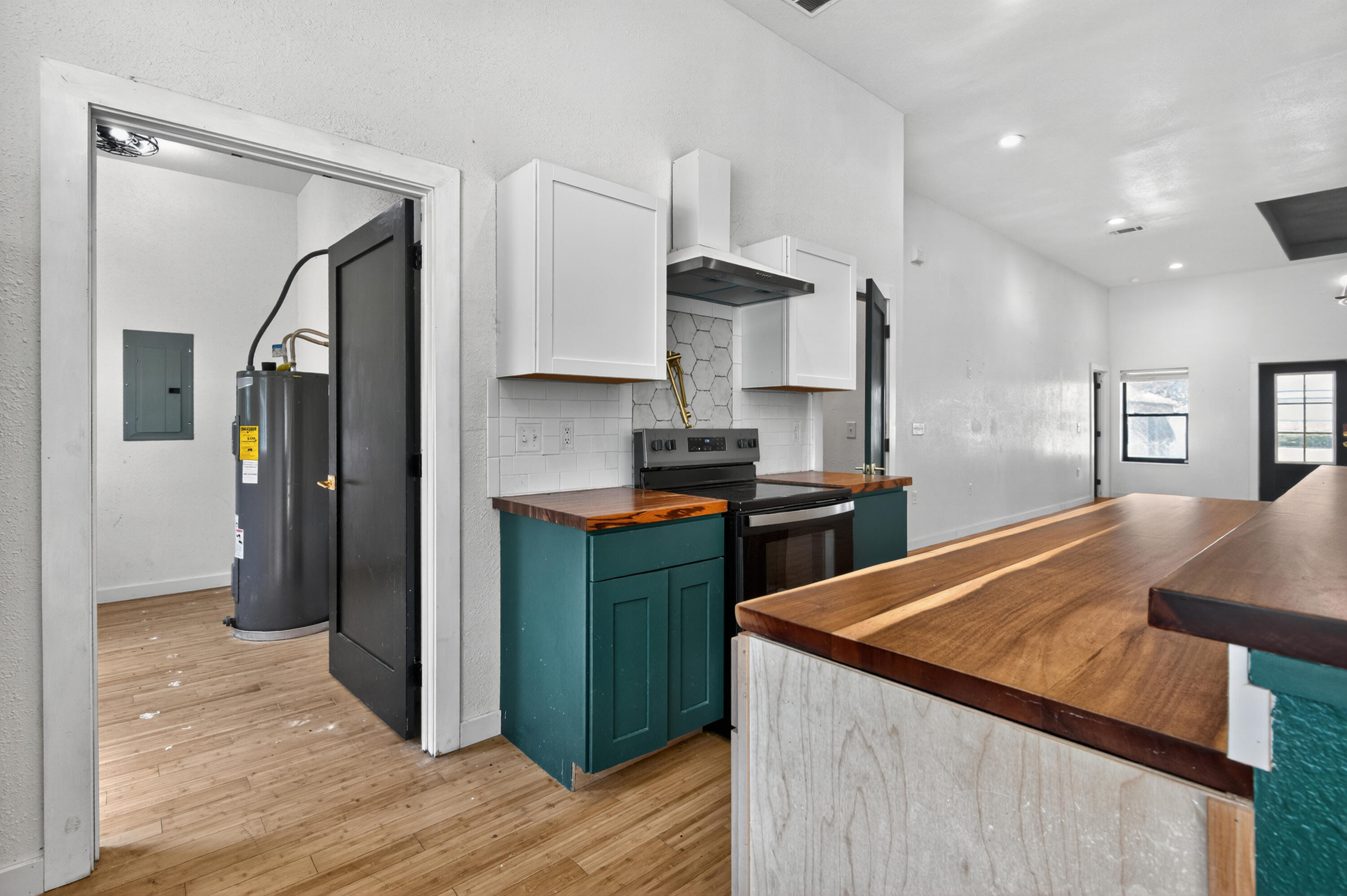 115 Ridgewood Avenue Mary Esther, FL 32569 - Photo 25 of 54 a kitchen with stainless steel appliances granite countertop a refrigerator a stove and a sink