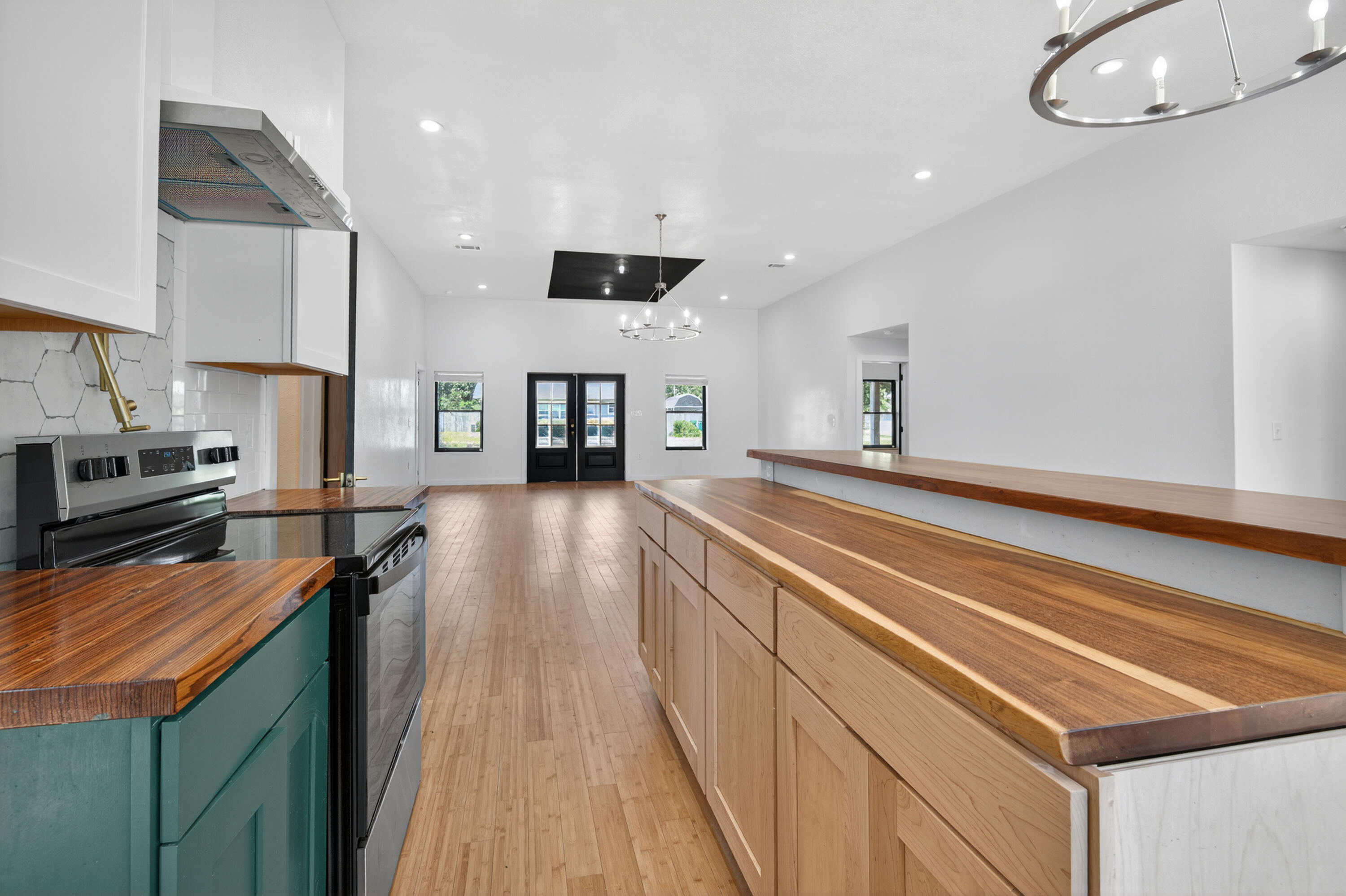 115 Ridgewood Avenue Mary Esther, FL 32569 - Photo 28 of 54 a kitchen with stainless steel appliances granite countertop a stove and a sink