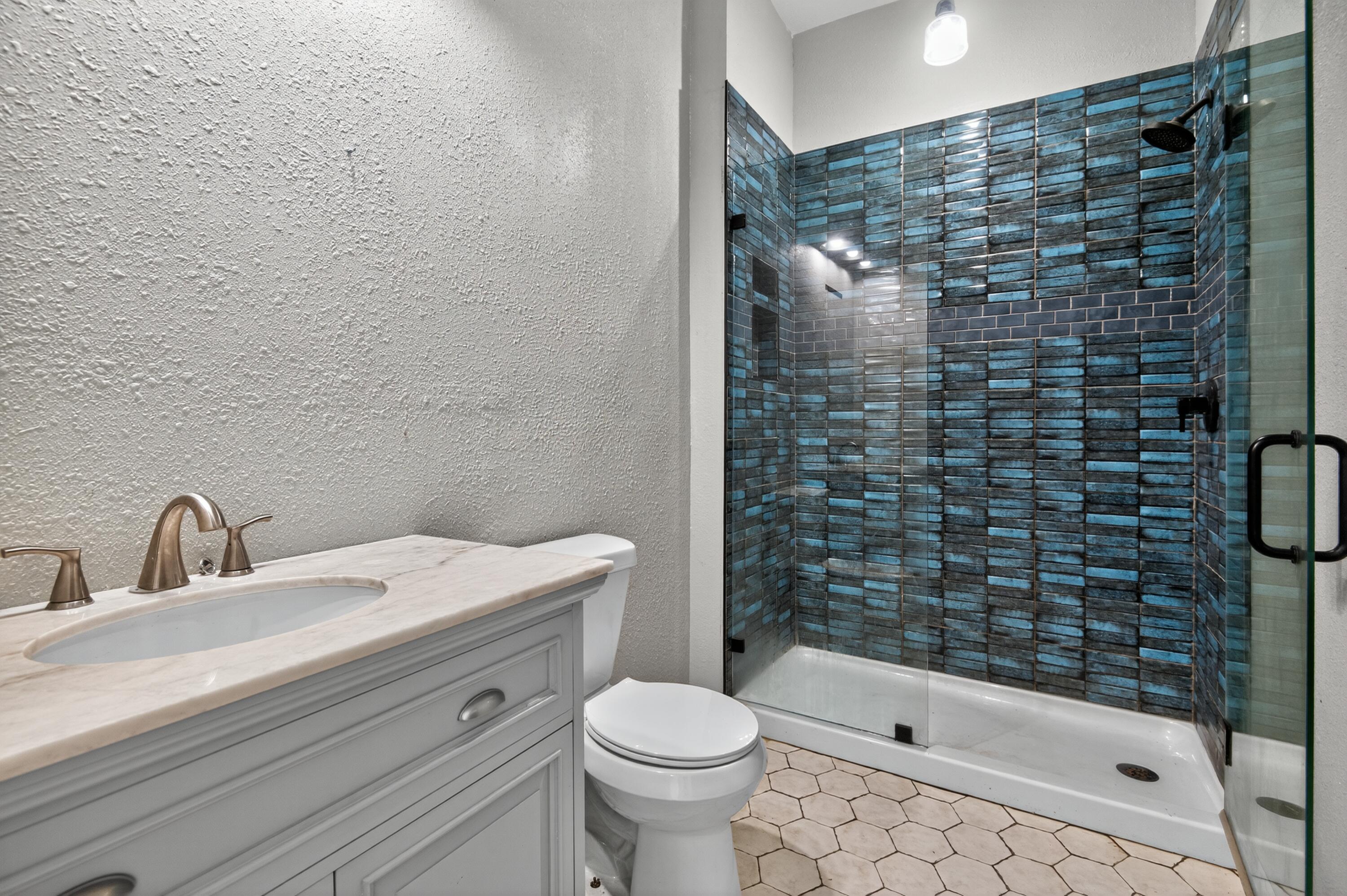 115 Ridgewood Avenue Mary Esther, FL 32569 - Photo 33 of 54 a bathroom with a sink toilet and shower