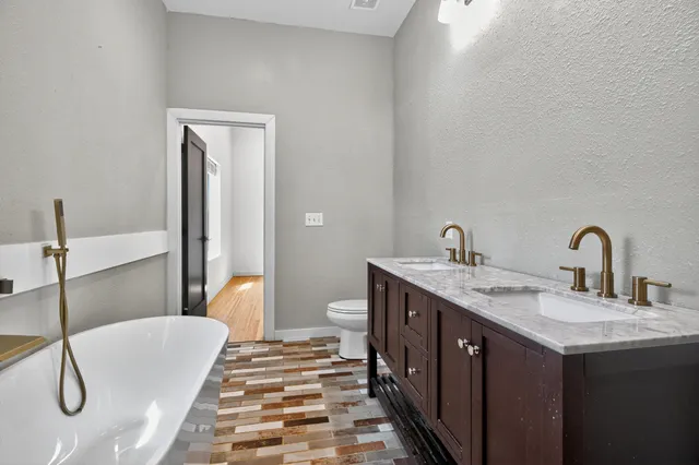 a view of room with wooden floor