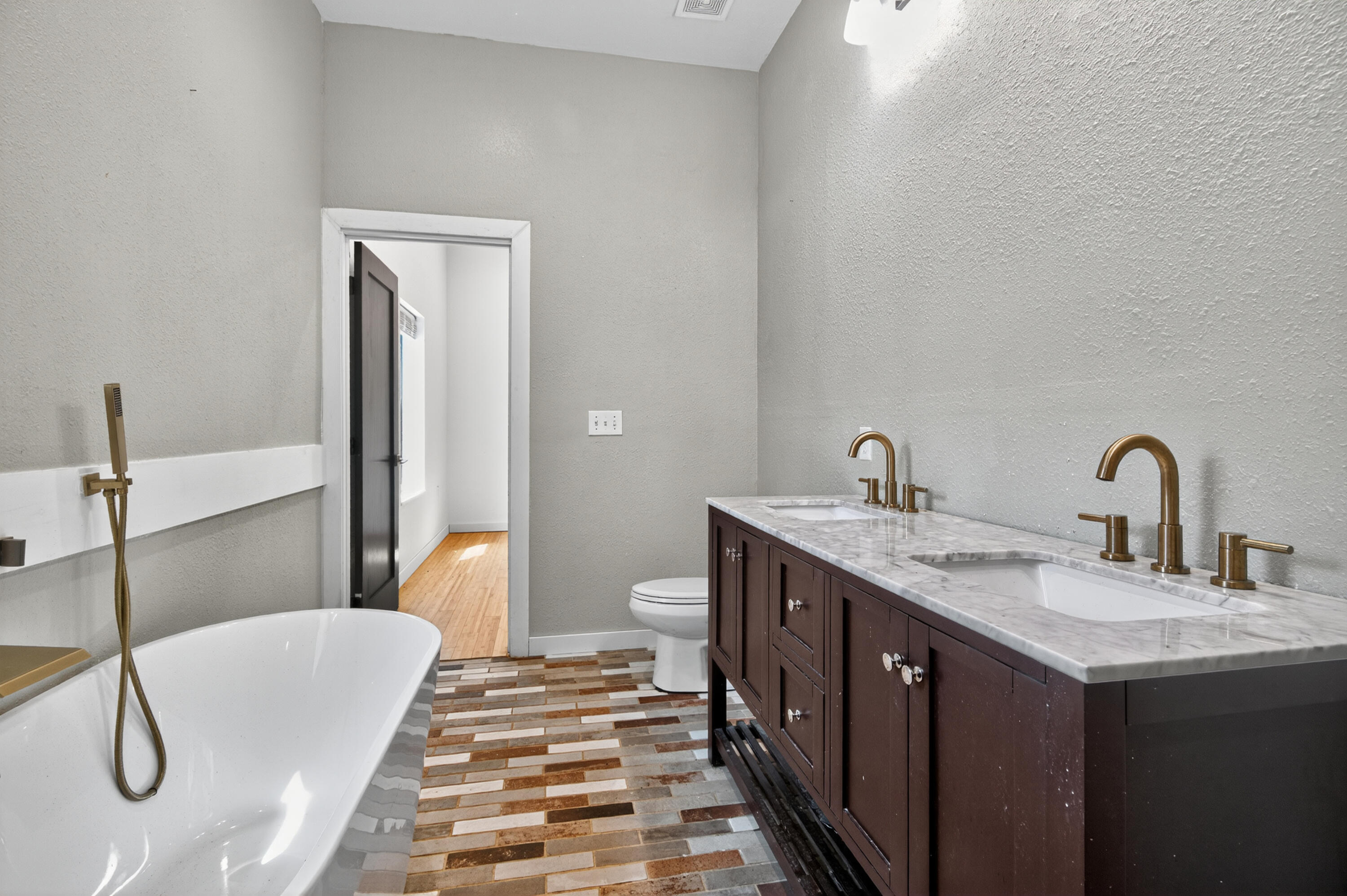 115 Ridgewood Avenue Mary Esther, FL 32569 - Photo 35 of 54 a en suite bathroom with a double vanity sink and a mirror