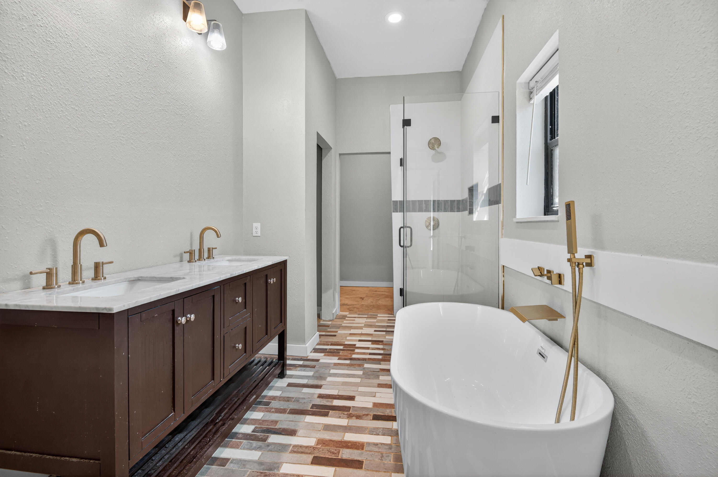 115 Ridgewood Avenue Mary Esther, FL 32569 - Photo 36 of 54 a en suite bathroom with a bathtub sink and mirror