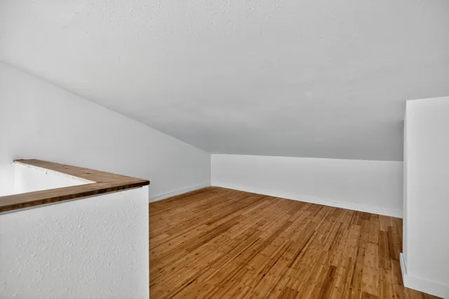 a picture of a book and a white bed