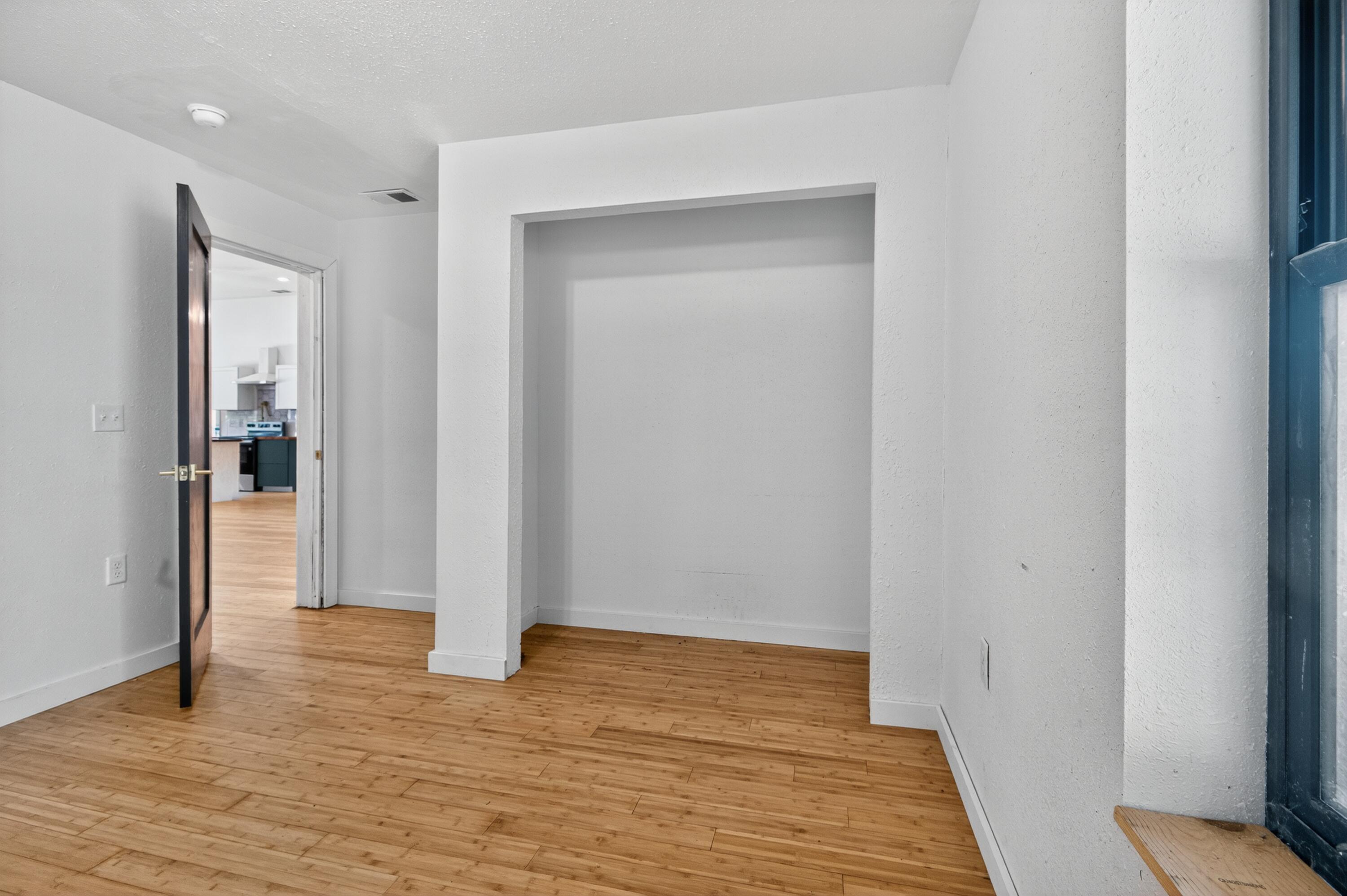 115 Ridgewood Avenue Mary Esther, FL 32569 - Photo 46 of 54 a view of a room with wooden floor and a hallway