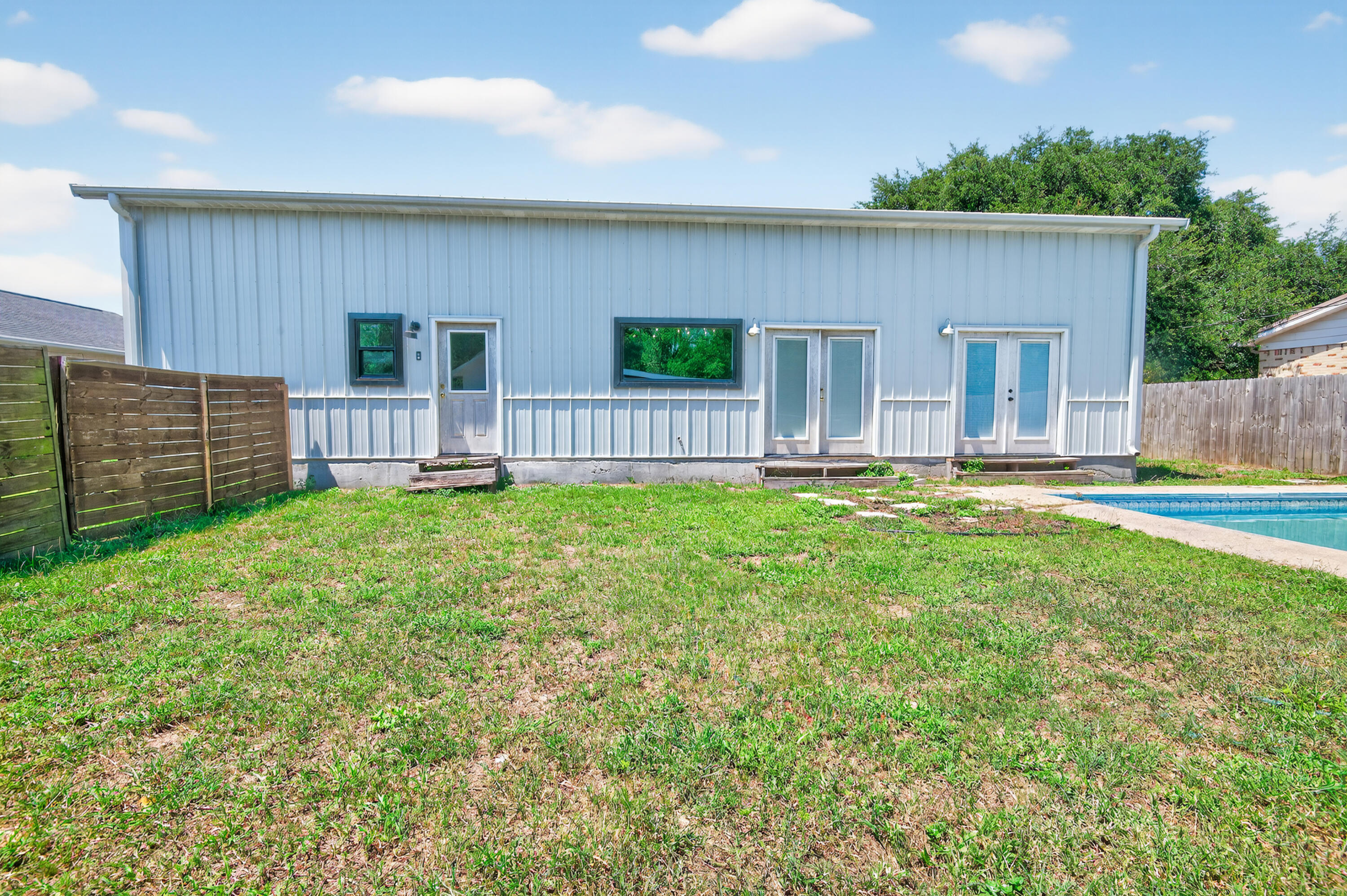 115 Ridgewood Avenue Mary Esther, FL 32569 - Photo 5 of 54 a house view with a garden space