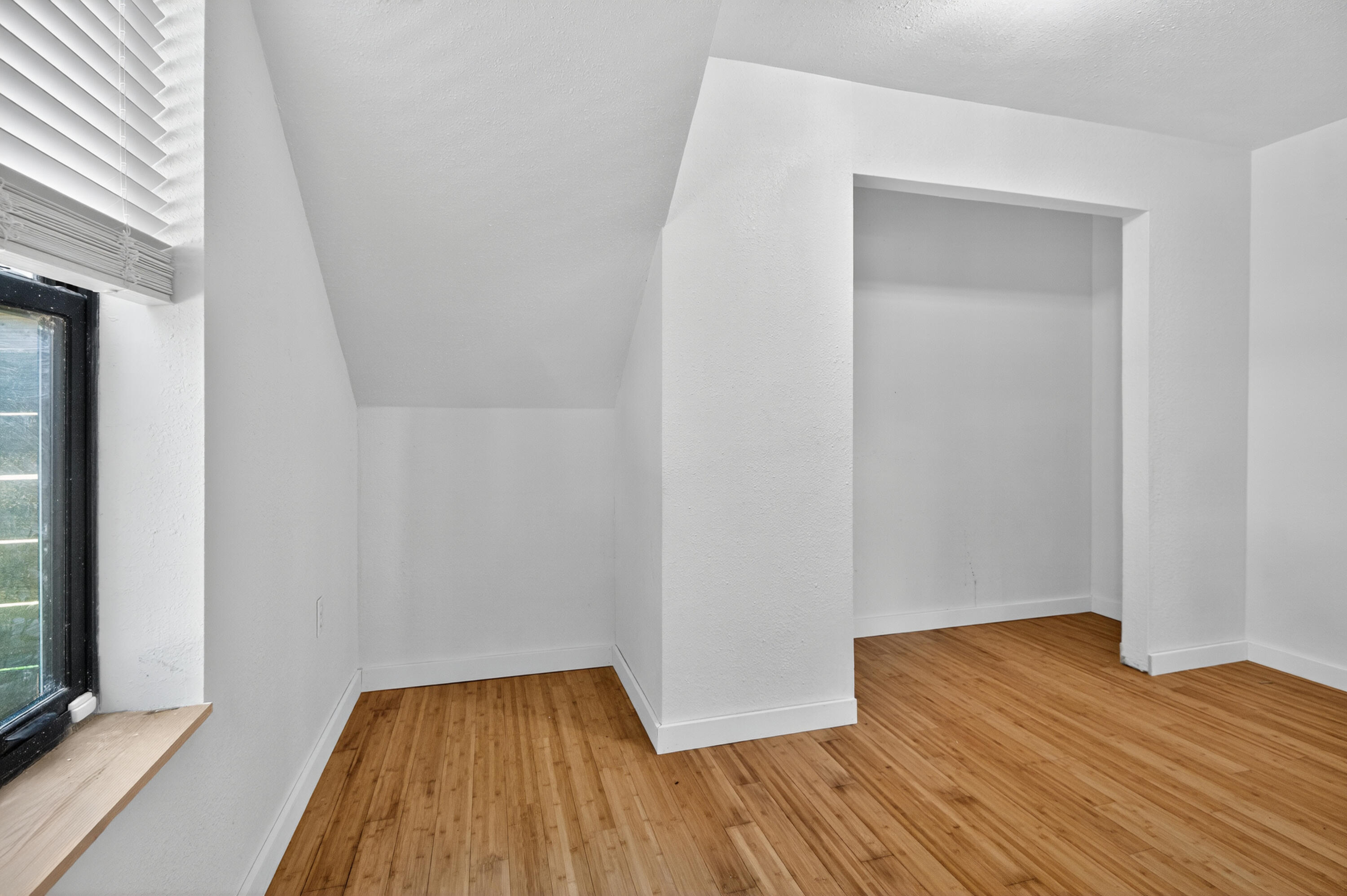 115 Ridgewood Avenue Mary Esther, FL 32569 - Photo 51 of 54 a view of a room with wooden floor and a window
