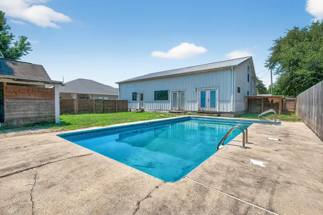 a view of a backyard with a garden and plants