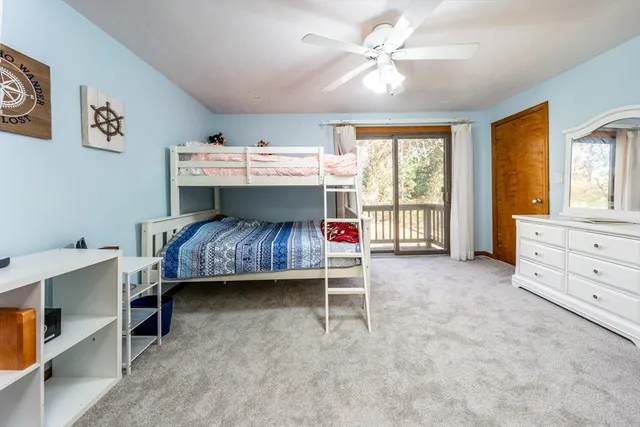 a bed room with a bed and a window