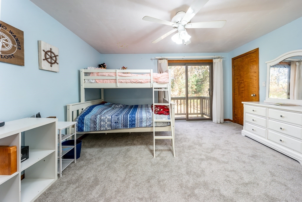 195 Falmouth Road, Unit 9D Mashpee, MA 02649 - Photo 16 of 29 a bed room with a bed and a window