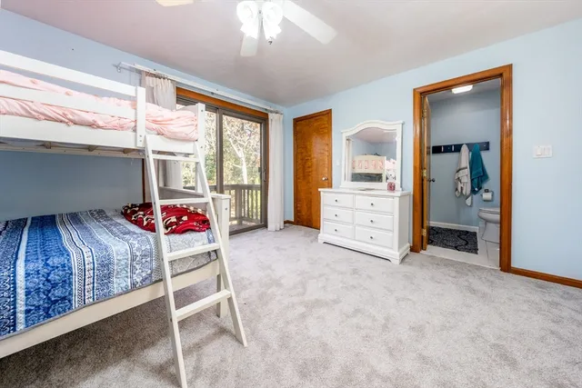 a living room with furniture and a dresser