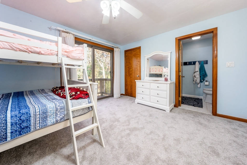 195 Falmouth Road, Unit 9D Mashpee, MA 02649 - Photo 17 of 29 a living room with furniture and a dresser