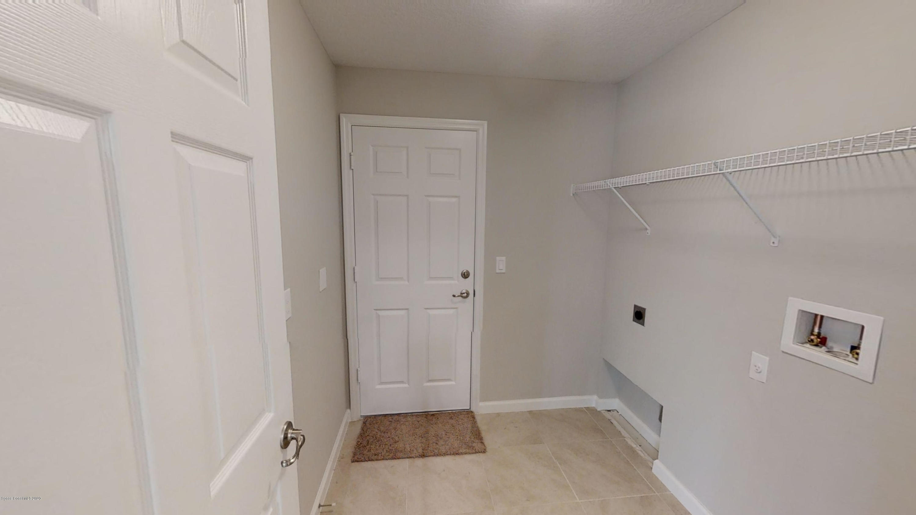 1000 Cranberry Road Southeast Palm Bay, FL 32909 - Photo 15 of 15 Hudson-4-Left-Side-Garage-01072020_09343