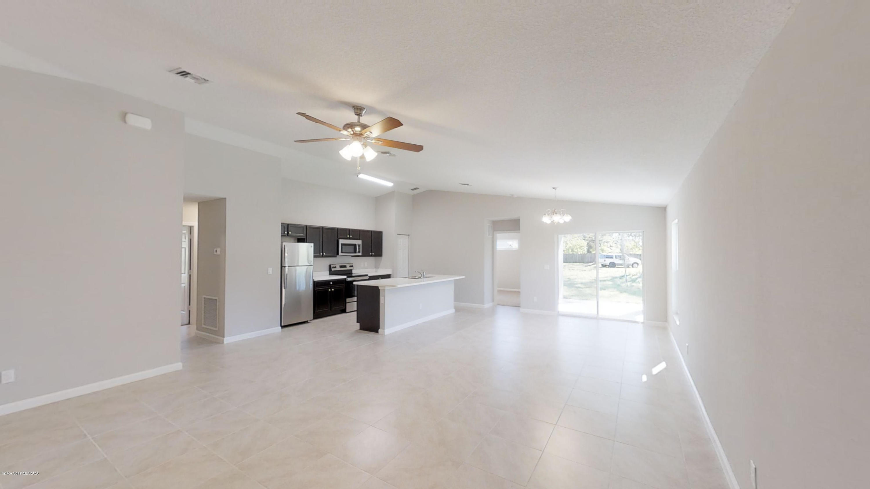 1000 Cranberry Road Southeast Palm Bay, FL 32909 - Photo 4 of 15 Hudson-4-Left-Side-Garage-01072020_09294