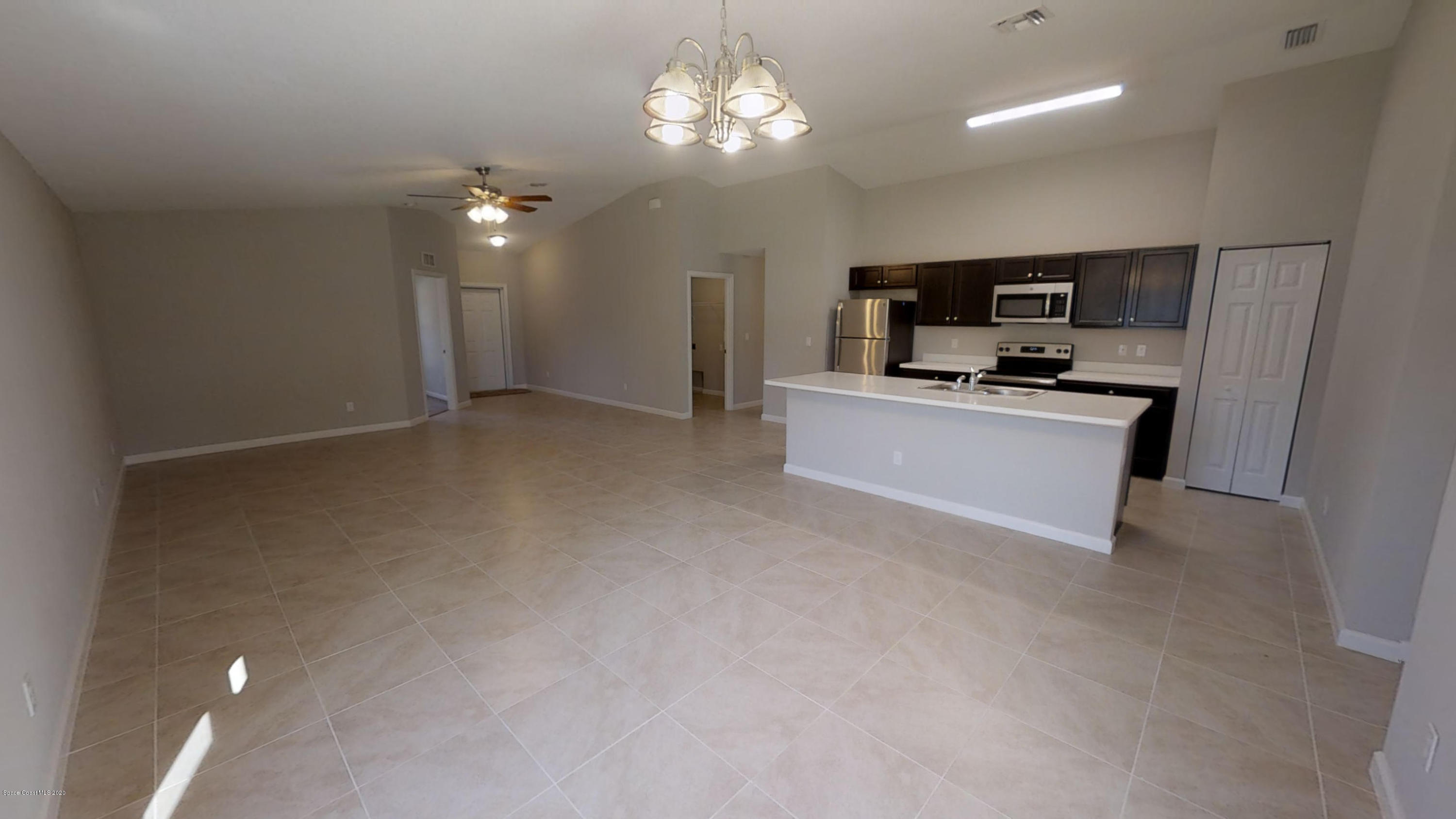 1000 Cranberry Road Southeast Palm Bay, FL 32909 - Photo 5 of 15 Hudson-4-Left-Side-Garage-01072020_09301
