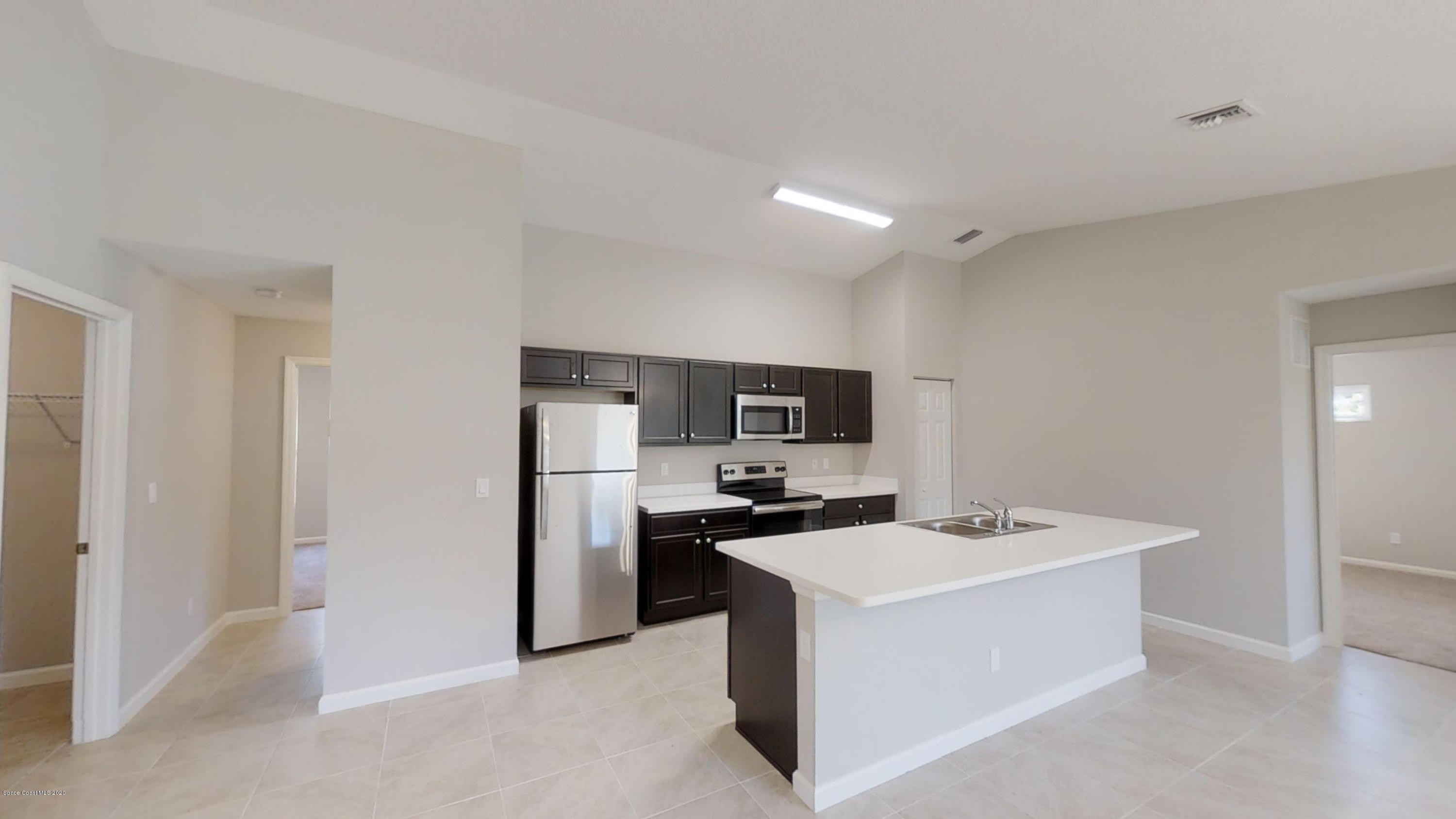 1000 Cranberry Road Southeast Palm Bay, FL 32909 - Photo 6 of 15 Hudson-4-Left-Side-Garage-01072020_09303