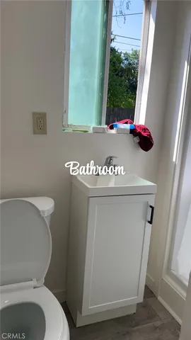 a bathroom with a toilet and a sink