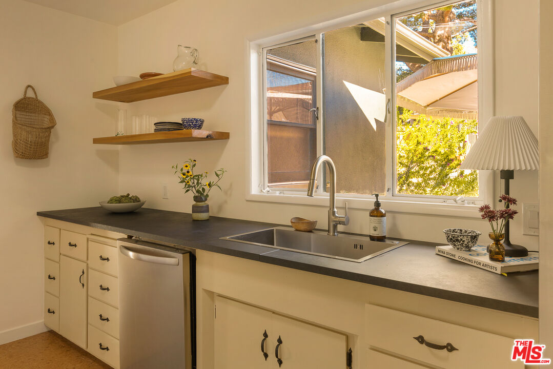 10816 Redmont Avenue Tujunga, CA 91042 - Photo 12 of 31 a kitchen with a sink and a stove