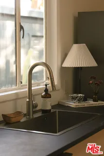 a kitchen with a sink and a stove