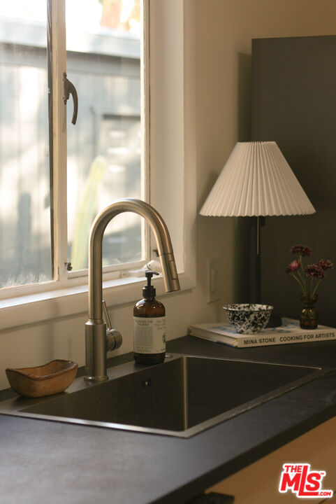 10816 Redmont Avenue Tujunga, CA 91042 - Photo 13 of 31 a kitchen with a sink and a stove