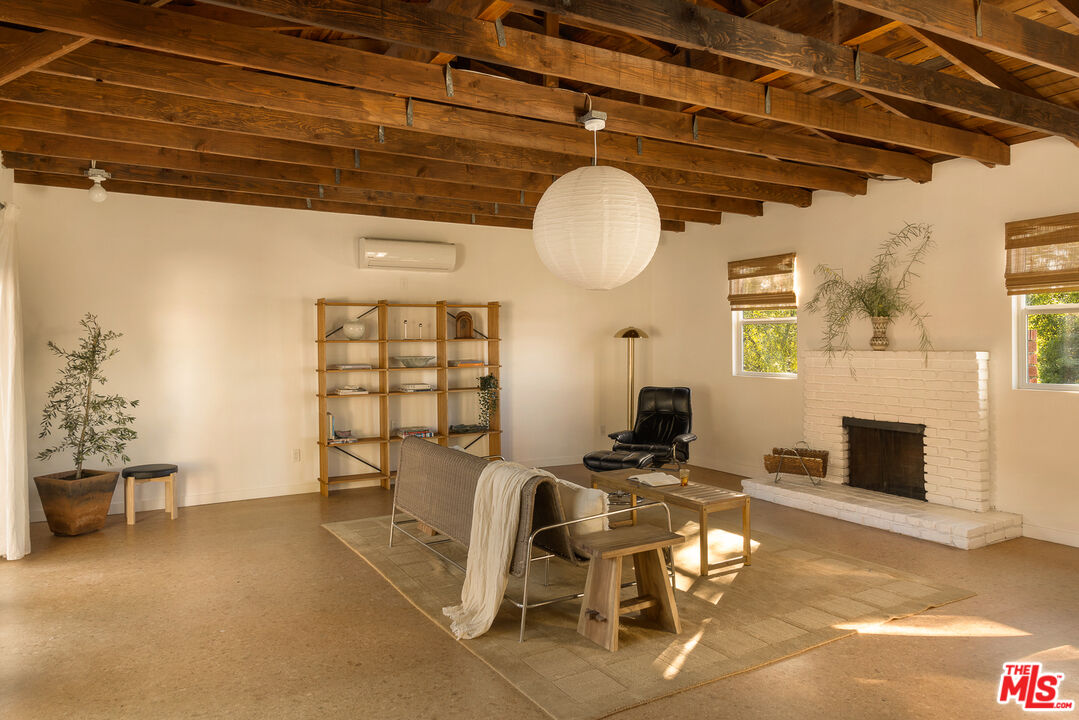 10816 Redmont Avenue Tujunga, CA 91042 - Photo 18 of 31 a view of a livingroom with furniture and a fireplace