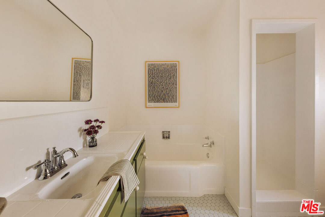 10816 Redmont Avenue Tujunga, CA 91042 - Photo 21 of 31 a bathroom with a sink and a bathtub