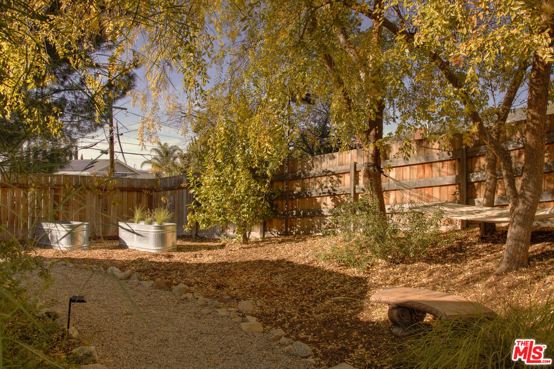 10816 Redmont Avenue Tujunga, CA 91042 - Photo 28 of 31 a view of a yard with a tree