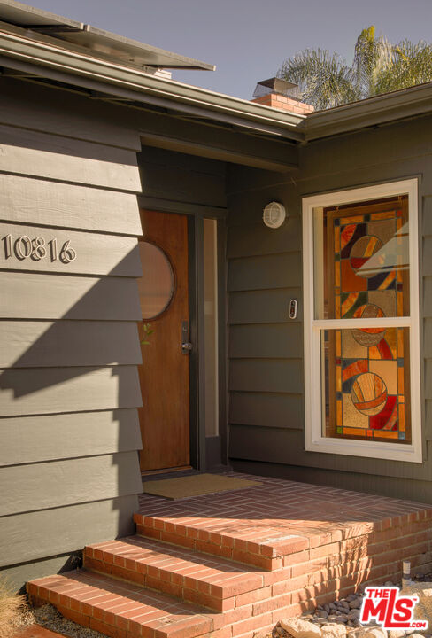 10816 Redmont Avenue Tujunga, CA 91042 - Photo 3 of 31 a view of door with wooden floor