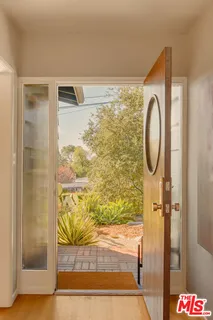 a bathroom with a shower and a mirror