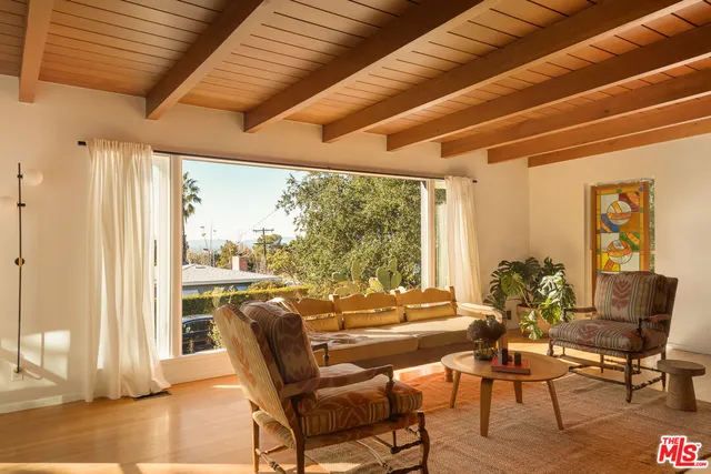 a view of a livingroom with furniture and a fireplace