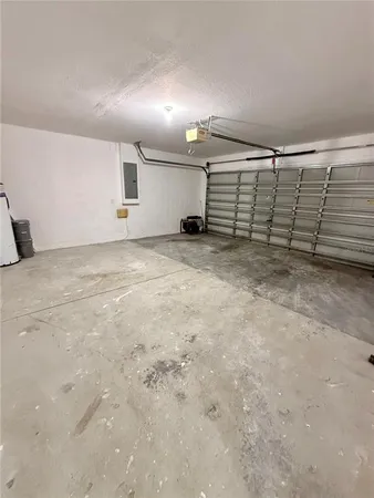 a view of an empty room with a ceiling fan