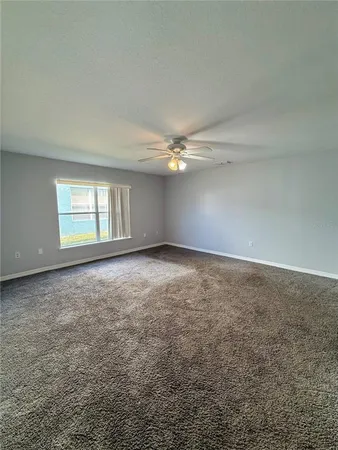 a view of a livingroom with an empty space and a sink