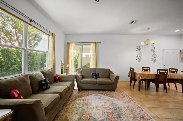 a view of a backyard with a tree