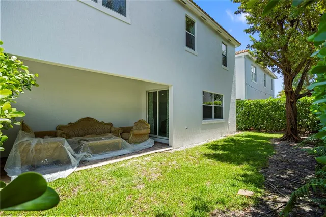 a bedroom with a bed and a piano