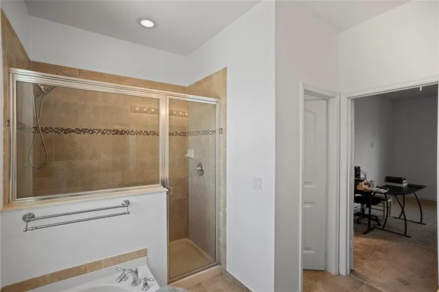 a view of a hallway with wooden shelves