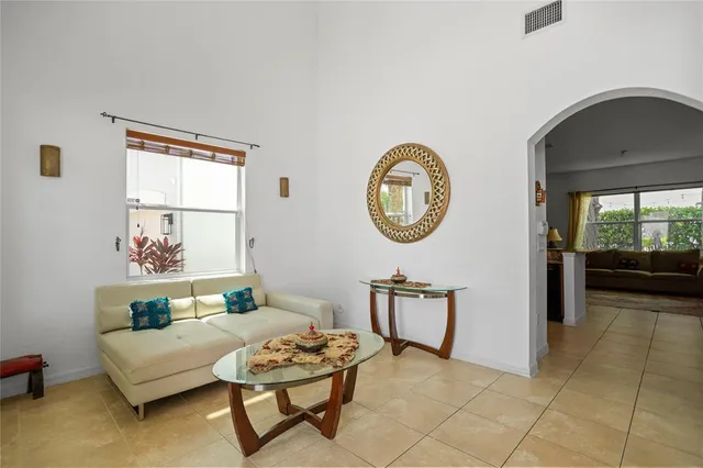a view of a livingroom with furniture and entryway