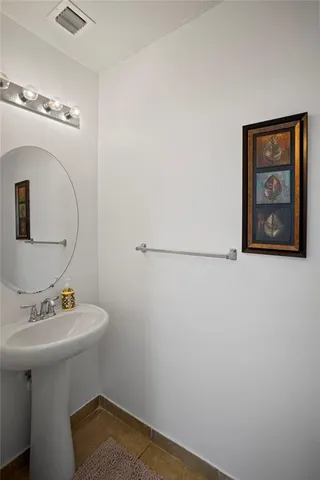 a bathroom with a toilet and a sink