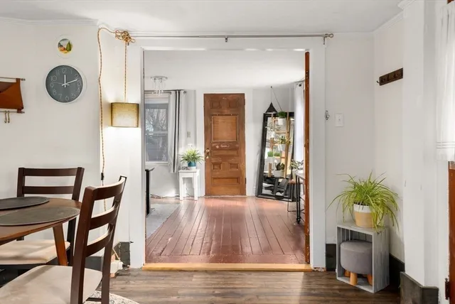 a workspace with furniture window and wooden floor