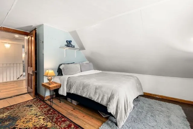 a bedroom with a bed and a desk