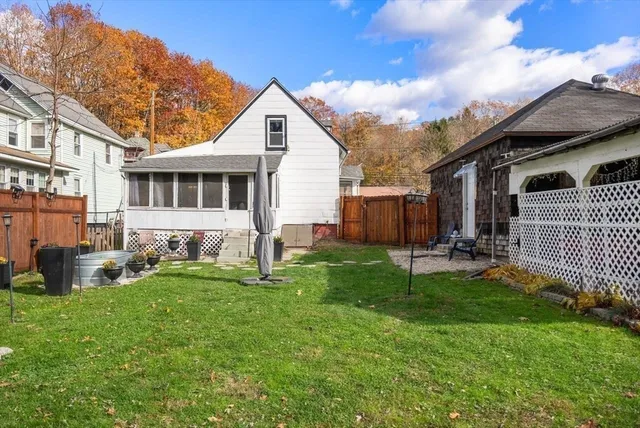 a building outdoor space with patio furniture and windows