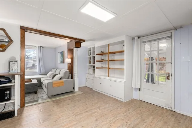 a view of a livingroom with furniture and cabinet