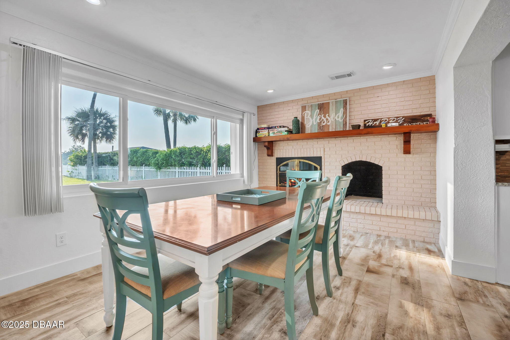 450 Lambert Avenue Flagler Beach, FL 32136 - Photo 14 of 47 a dining room with furniture and a floor to ceiling window