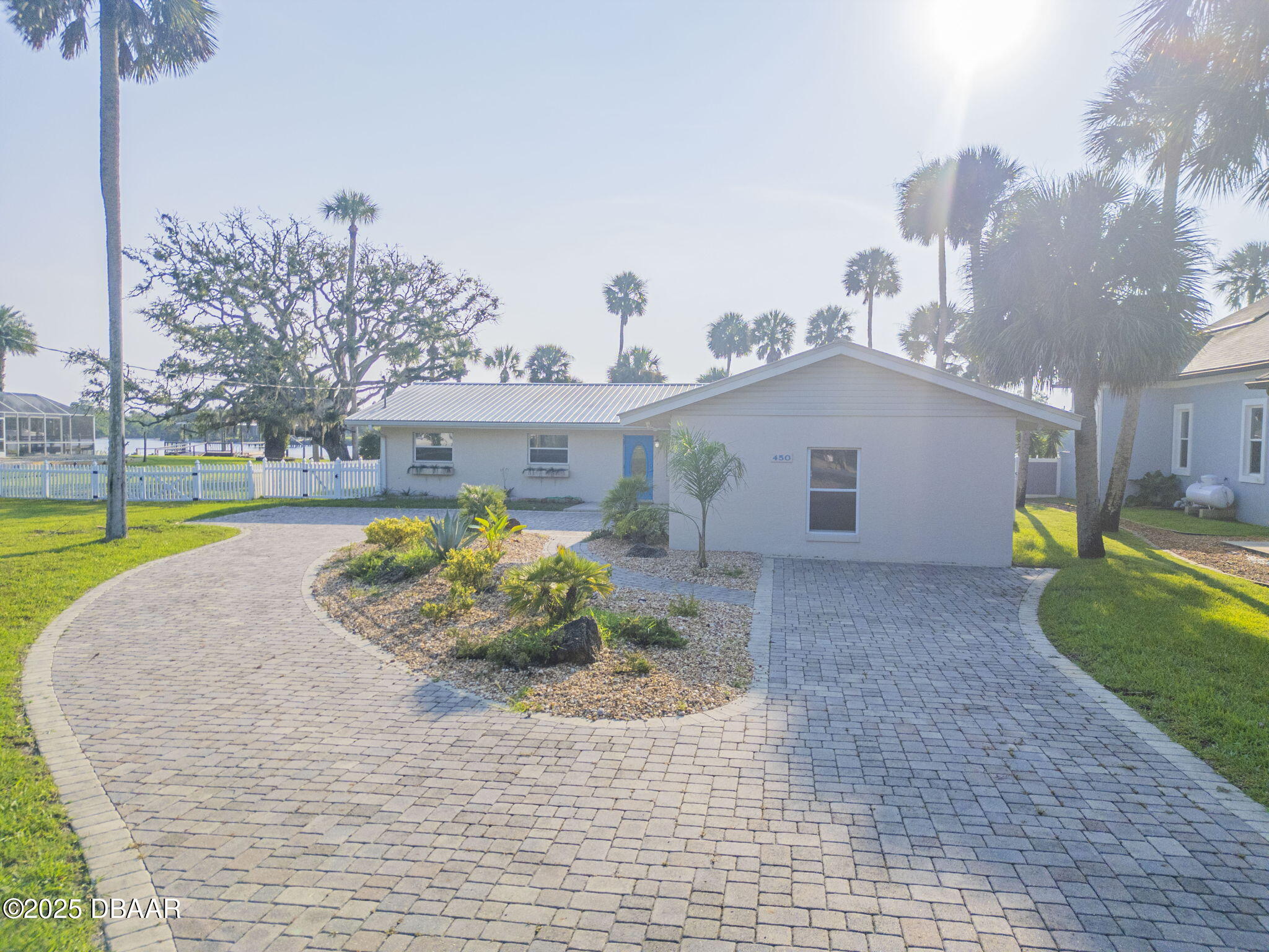 450 Lambert Avenue Flagler Beach, FL 32136 - Photo 37 of 47 a view of a house with a yard and a porch