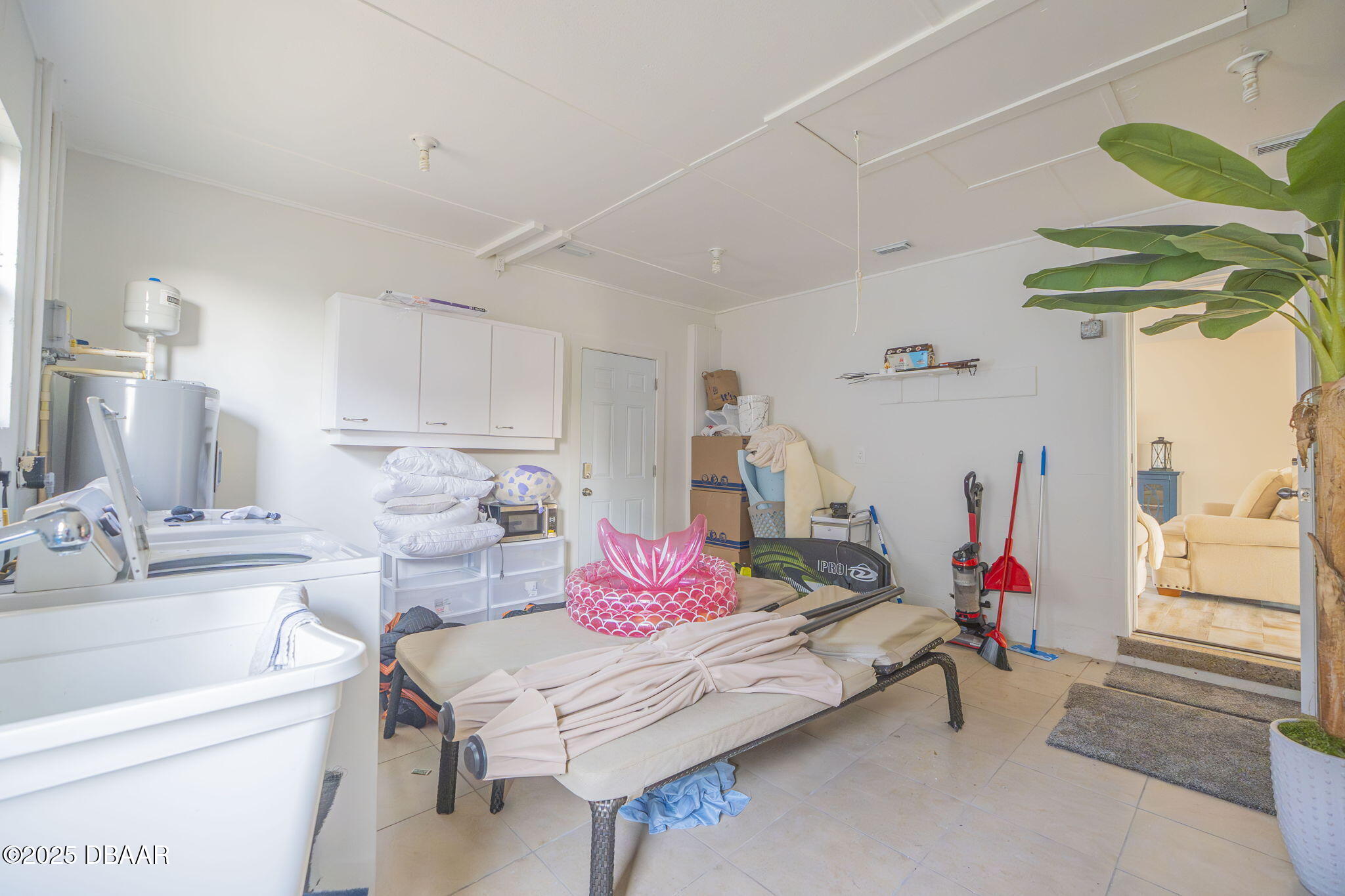 450 Lambert Avenue Flagler Beach, FL 32136 - Photo 46 of 47 a living room with furniture flowerpot and a rug