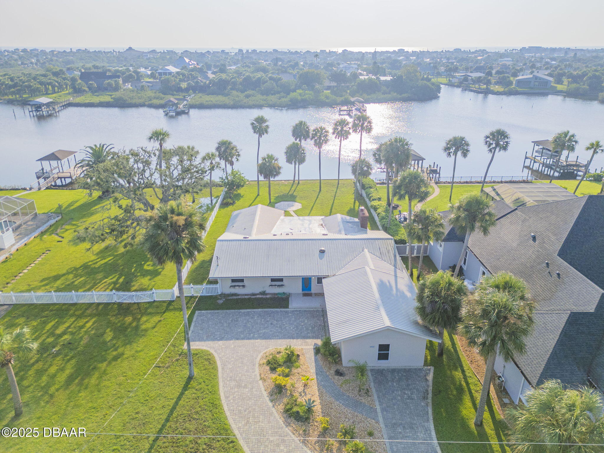 450 Lambert Avenue Flagler Beach, FL 32136 - Photo 5 of 47 an aerial view of a house with a lake view