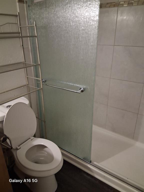 1501 East Interstate 30, Unit 223 Garland, TX 75043 - Photo 12 of 19 a bathroom with a toilet and a shower