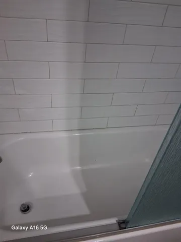 a close view of a sink a stove and a microwave