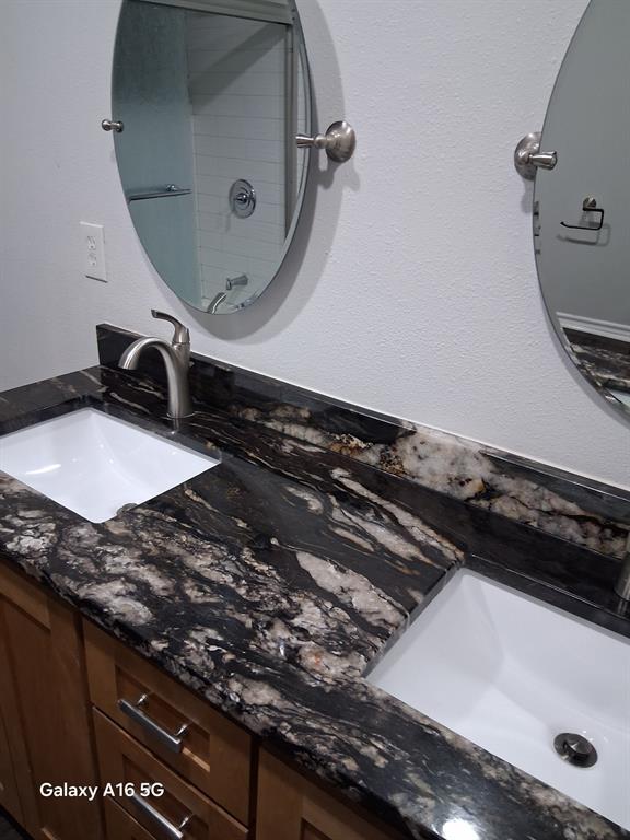 1501 East Interstate 30, Unit 223 Garland, TX 75043 - Photo 17 of 19 a close view of a sink a stove and a microwave