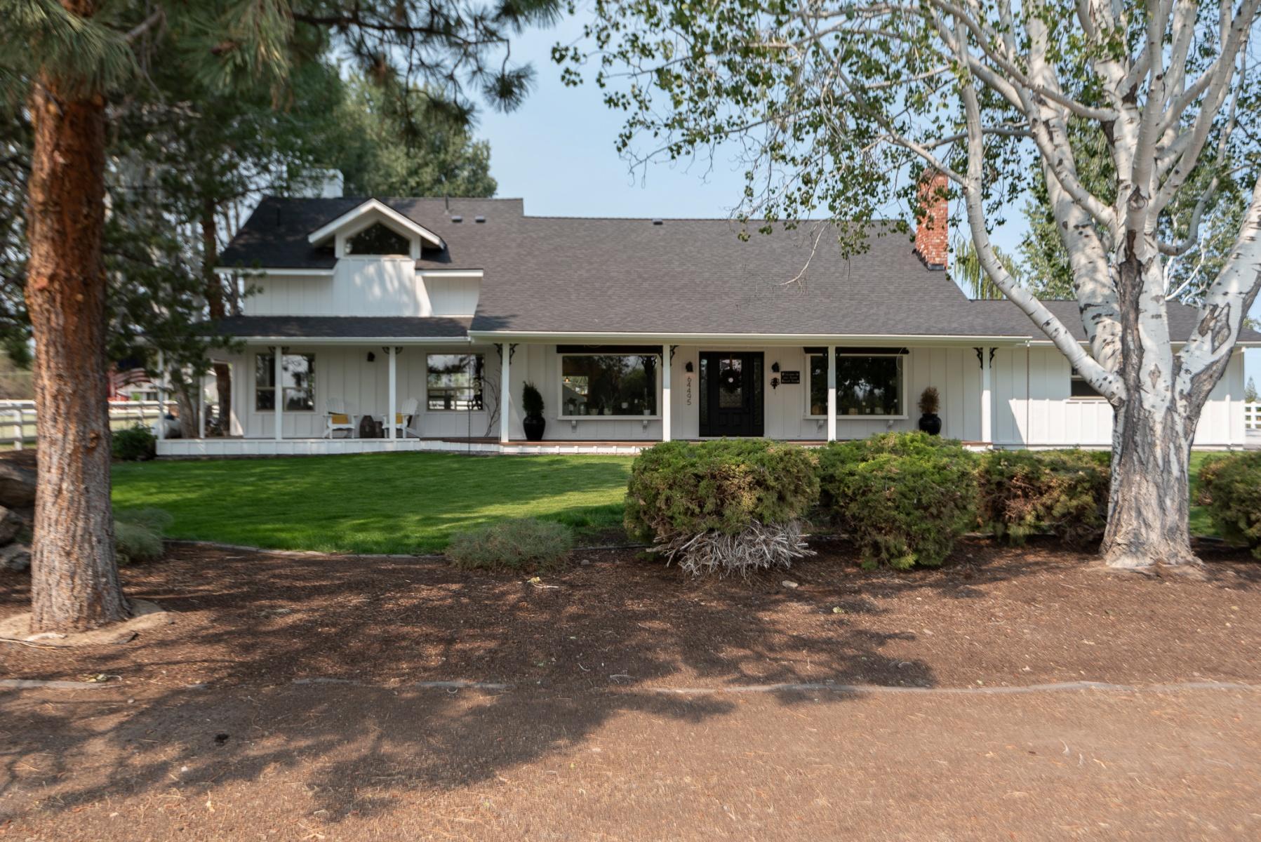 64495 Research Road Bend, OR 97703 - Photo 1 of 54 a front view of a house with garden