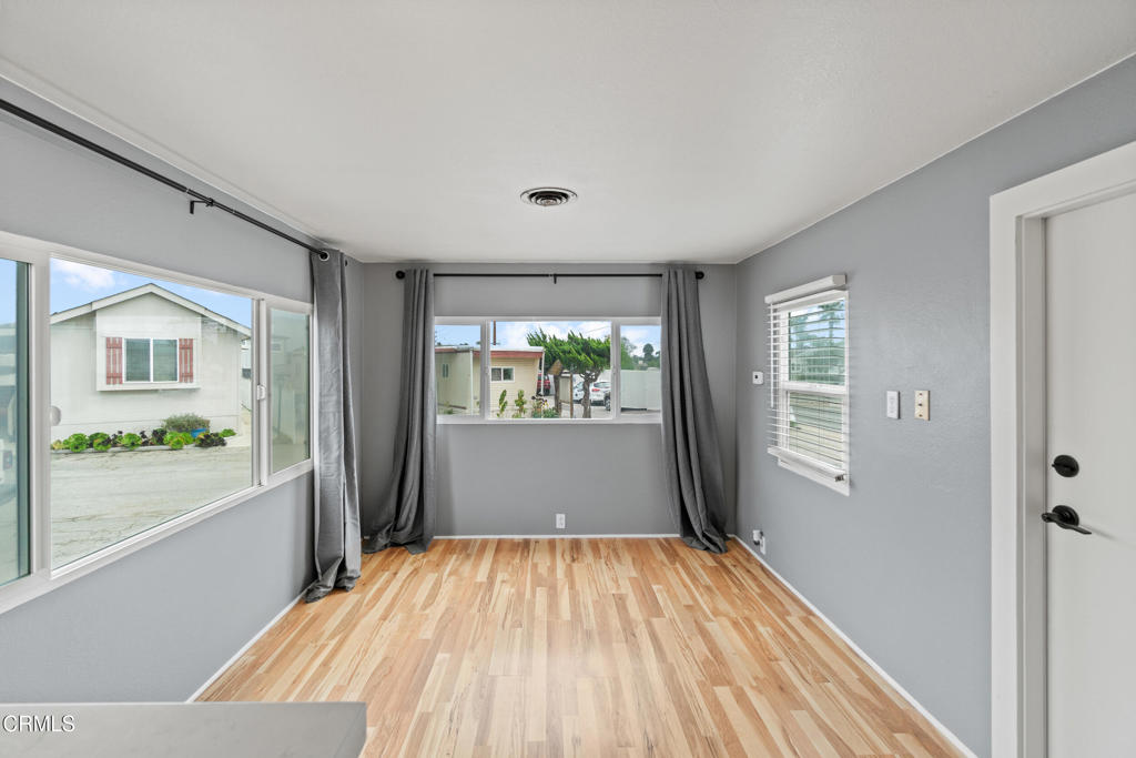 7368 Hollister Avenue, Unit 28 Goleta, CA 93117 - Photo 11 of 33 wooden floor in an empty room with a window
